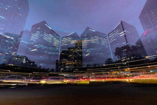Vibrant night cityscape of Mexico City with light trails and tall skyscrapers.