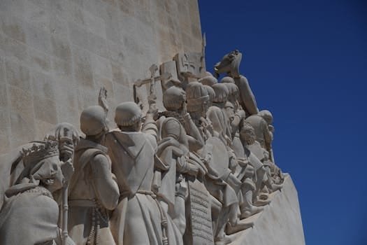 Statues depicting historical figures on Lisbon's Monument to the Discoveries.