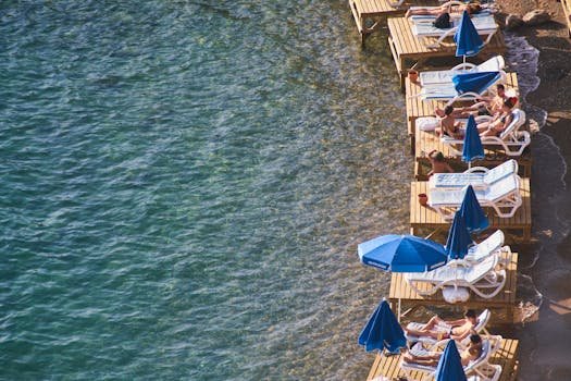 Relaxing on wooden platforms by the beach in Antalya, Turkey.