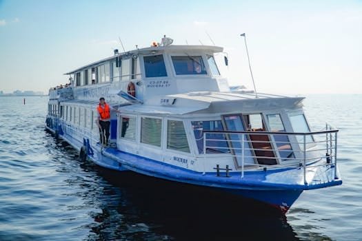 A scenic view of a passenger ferry navigating the Neva River in St. Petersburg, Russia.