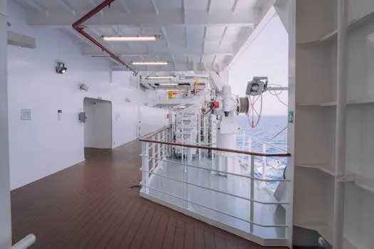Spacious cruise ship deck featuring safety equipment and ocean view, ideal for travel themes.